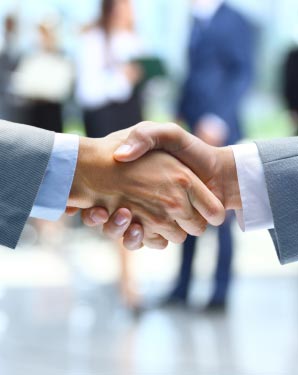An image of people shaking hands after a successful meeting with legal counsel.