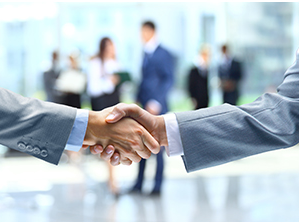 An image of two people shaking hands coming out of a law firm meeting.